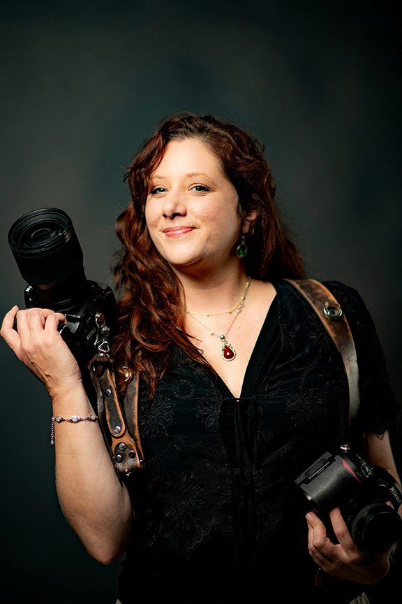 Tiffany Teso photographer with dual cameras at a wedding in Western North Carolina